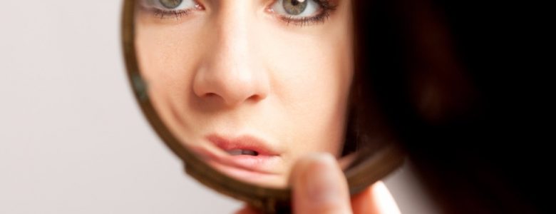 closeup mirror reflection of a womans face picture id471381239 1 e1503496845451